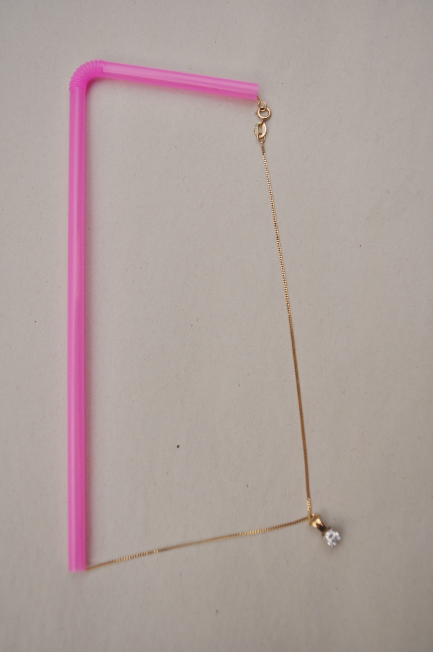 Straw to keep necklace untangled